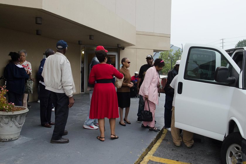 Elderly voters board a van that will take them to a polling station in Atlanta on the first day of early voting, Oct. 13, 2014. via Al Jazeera America 
