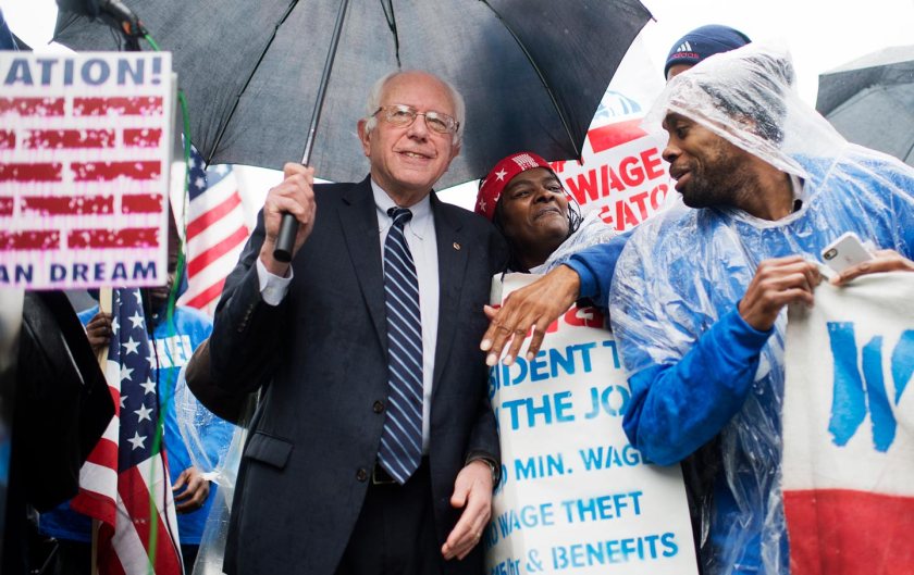 ﻿ Bernie Sanders attends a rally in Upper Senate Park with striking workers to call for a minimum wage of $15 per hour, November 10, 2015. (Tom Williams / CQ Roll Call via AP Images)